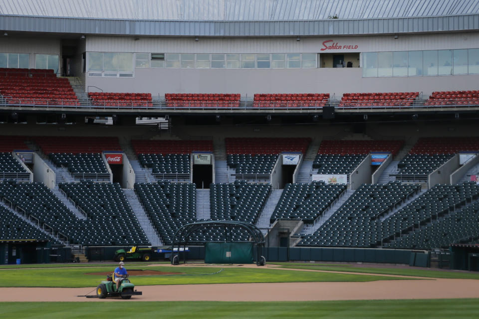 Grounds crew work on the field following the announcement that the Toronto Blue Jays will play their 2020 home games at Sahlen Field, their Triple-A affiliate, Friday, July 24, 2020, in Buffalo N.Y. (AP Photo/Jeffrey T. Barnes)