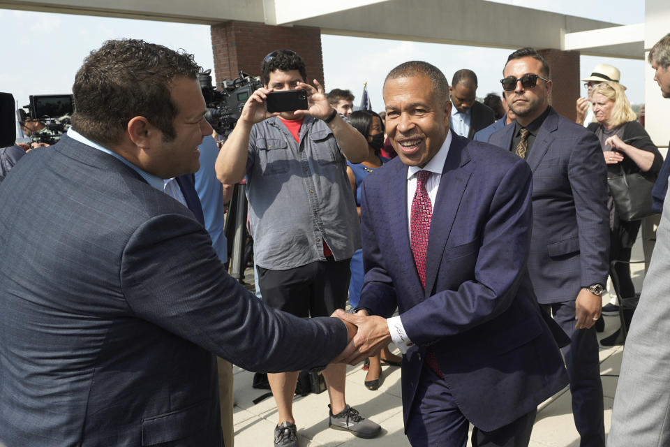 James Craig, a former Detroit Police Chief, shakes hands with supporters after announcing he is a Republican candidate for governor of Michigan in Detroit, Tuesday, Sept. 14, 2021. (AP Photo/Paul Sancya)