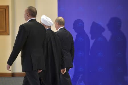 (R-L) Russia's President Vladimir Putin, Iran's President Hassan Rouhani and Azerbaijan's President Ilham Aliyev walk during a meeting in Tehran, Iran November 1, 2017. Sputnik/Alexei Druzhinin/Kremlin via REUTERS