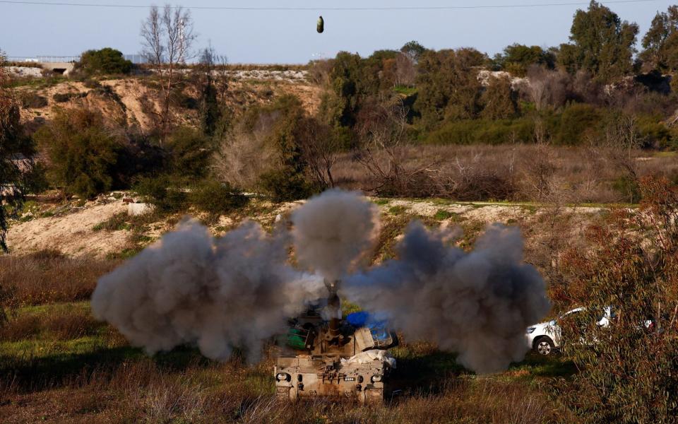 An Israeli artillery unit fires towards Gaza on February 11