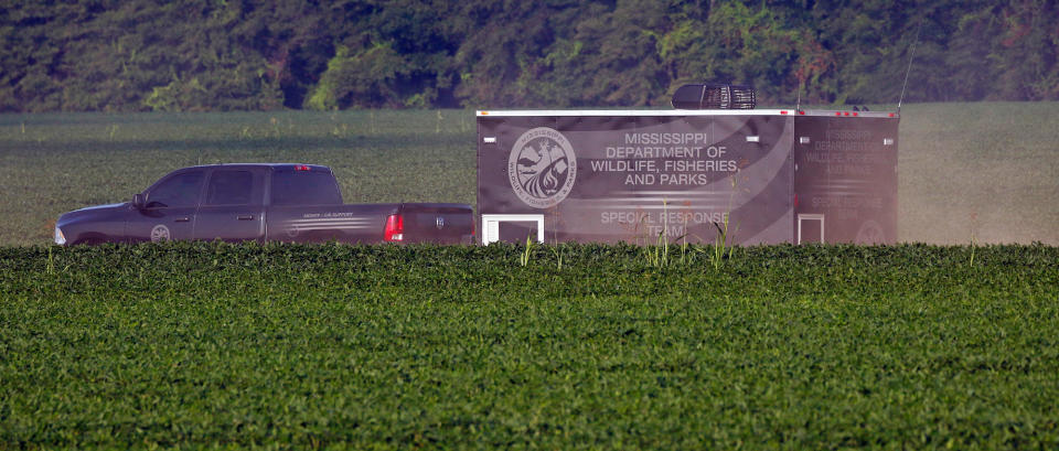 <p>Mississippi wildlife law officers bring a special response trailer and a number of all terrain vehicles to a county farm road adjacent to U.S. Highway 82, as they head to the wreckage of a military refueling tanker aircraft that crashed Monday evening in a soybean field near Itta Bena, Miss., on the western edge of Leflore County, Tuesday, July 11, 2007. (Photo: Rogelio V. Solis/AP) </p>