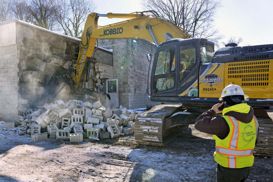 Workers begin demolition Wednesday, Jan. 17, 2023, at the Tree of Life building in Pittsburgh, the site of the deadliest antisemitic attack in U.S. history, as part of the effort to reimagine the building to honor the 11 people who were killed there in 2018. The new building will include spaces for worship, a museum, an education center and a movie theater. (AP Photo/Gene J. Puskar)