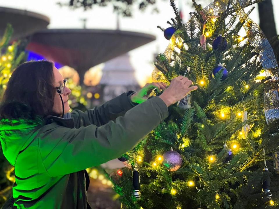 Kelly Finley hangs an ornament at Fantasy in Lights. This is the the 30th anniversary of Fantasy in Lights at Callaway Resort & Gardens. It features more than 10 million lights this year, and is Callaway Gardens’ kickoff to the holiday season, Rachael McConnell, marketing manager at Callaway Gardens. 11/18/2022