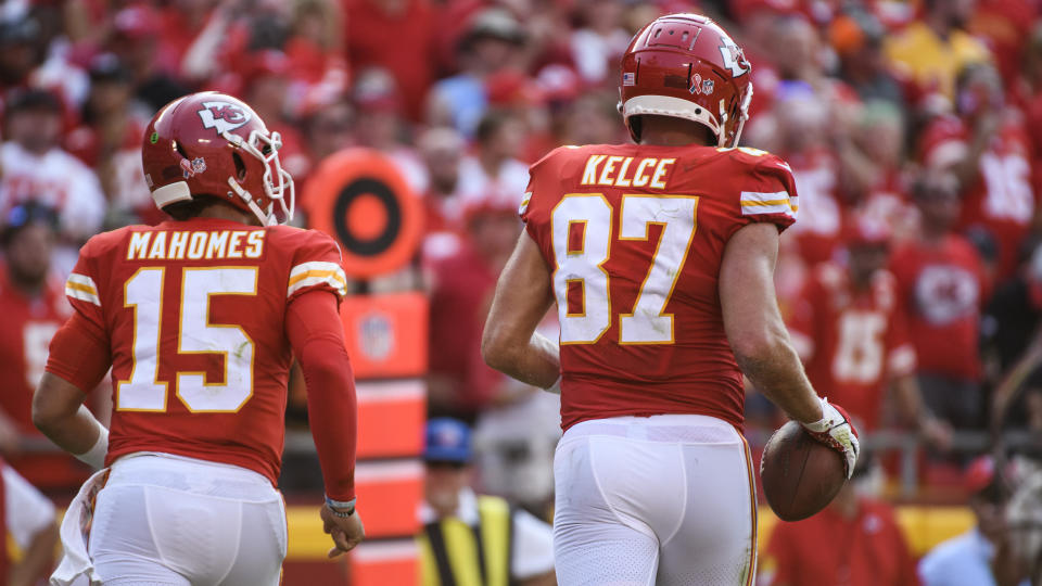 Kansas City Chiefs quarterback Patrick Mahomes and Kansas City Chiefs tight end Travis Kelce head off the field after connecting for a touchdown during the second half of an NFL football game against the Cleveland Browns, Sunday, Sept.12, 2021 in Kansas City, Mo. (AP Photo/Reed Hoffmann)
