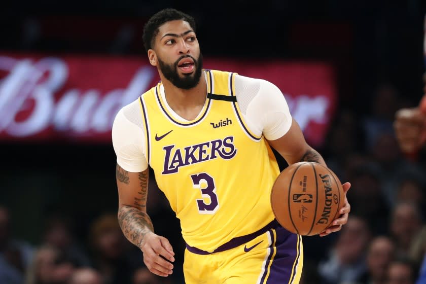 Los Angeles Lakers forward Anthony Davis (3) looks to pass during the first half of an NBA basketball game.