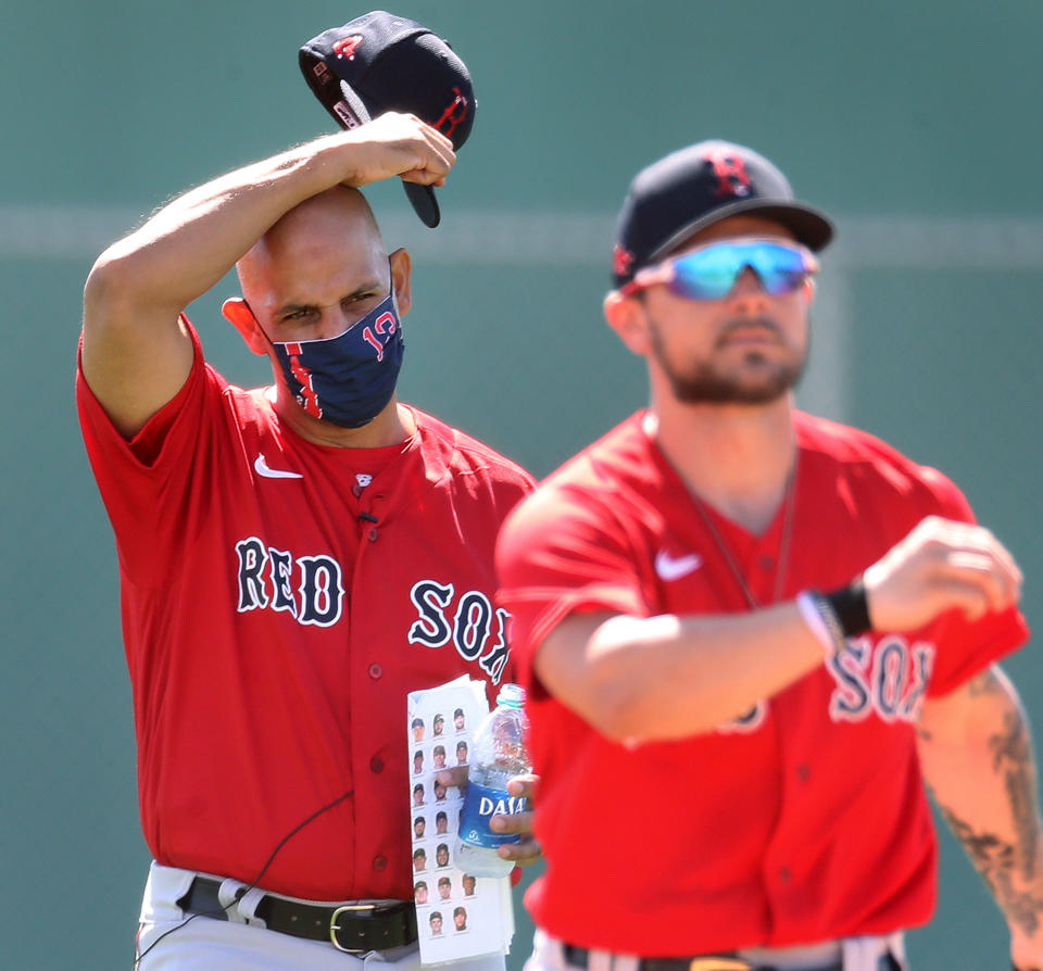 FORT MYERS - FEBRUARY 22: With all the new faces in the organization this season, Red Sox manager Alex Cora was carrying a paper with headshots of all the players around with him today. The Boston Red Sox held the first Spring Training workout open to the media at the JetBlue Park complex in Fort Myers, FL on Feb. 22, 2021. (Photo by Jim Davis/The Boston Globe via Getty Images)