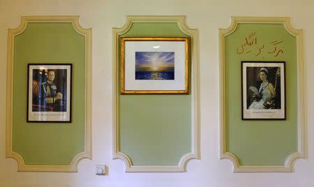 Graffiti in Persian reading "Death to England" is seen above a picture of Britain's Queen Elizabeth at the British Embassy in Tehran, Iran August 23, 2015. REUTERS/Darren Staples