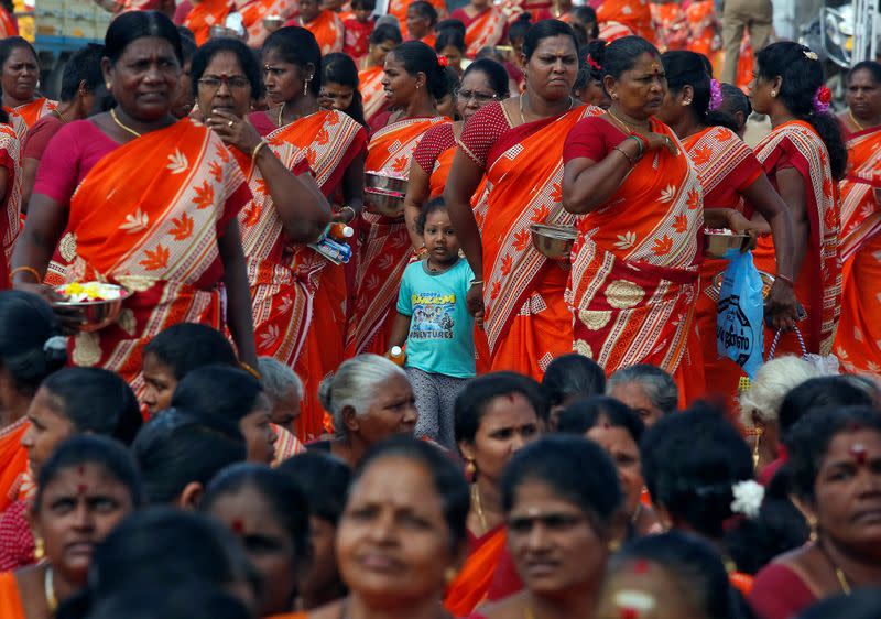 Women gather during a prayer ceremony for the victims of the 2004 tsunami on the 15th anniversary of the disaster, in Chennai