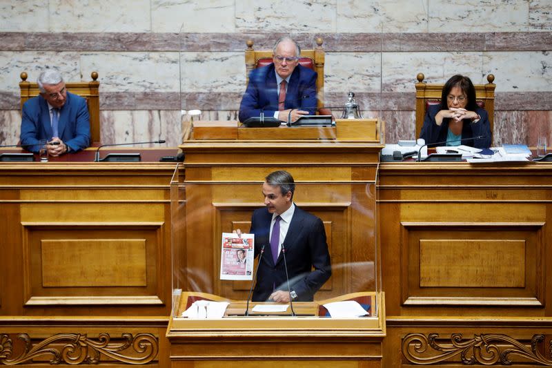 FILE PHOTO: Greek PM Mitsotakis addresses lawmakers during a parliamentary on a wiretapping case in Athens