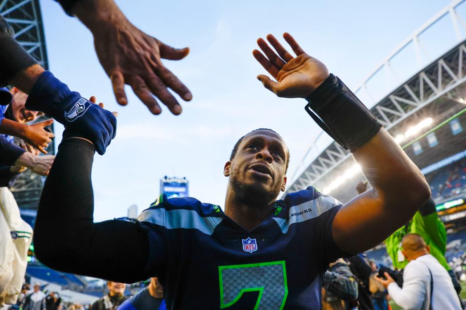 Seattle Seahawks quarterback Geno Smith (7) celebrates with fans following a 23-6 victory against the New York Jets at Lumen Field.