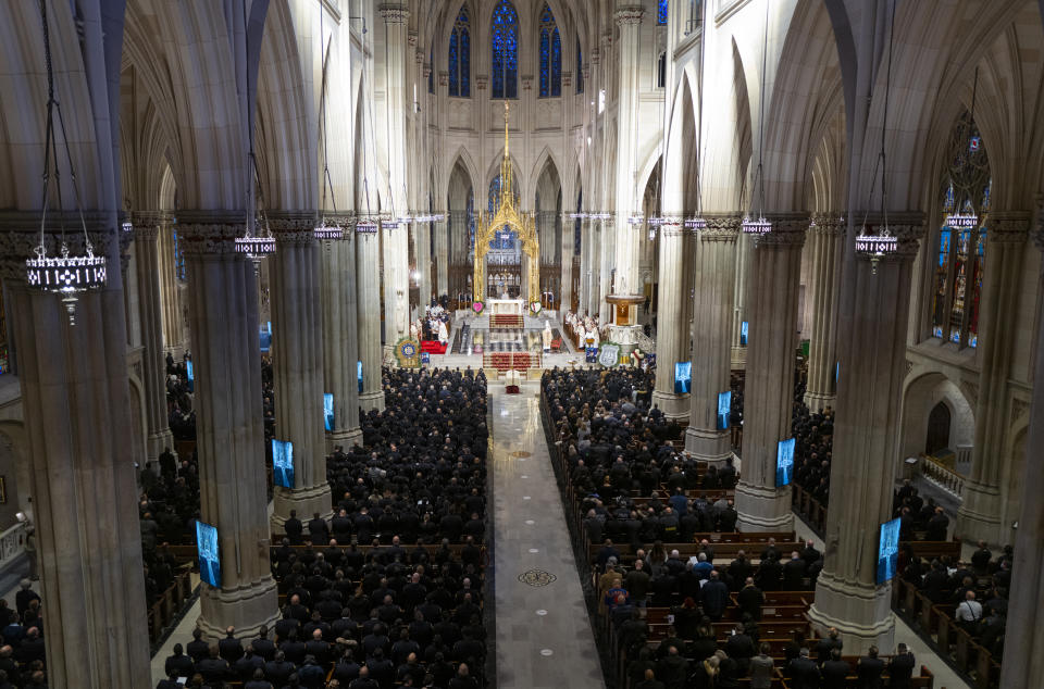 Slain NYPD officer Wilbert Mora is memorialized during a funeral service at St. Patrick's Cathedral in New York Wednesday, Feb. 2, 2022. Mora was shot and killed after responding to a domestic dispute call on Jan. 21 with his partner Jason Rivera, who was also fatally wounded. (Craig Ruttle/Newsday via AP, Pool)