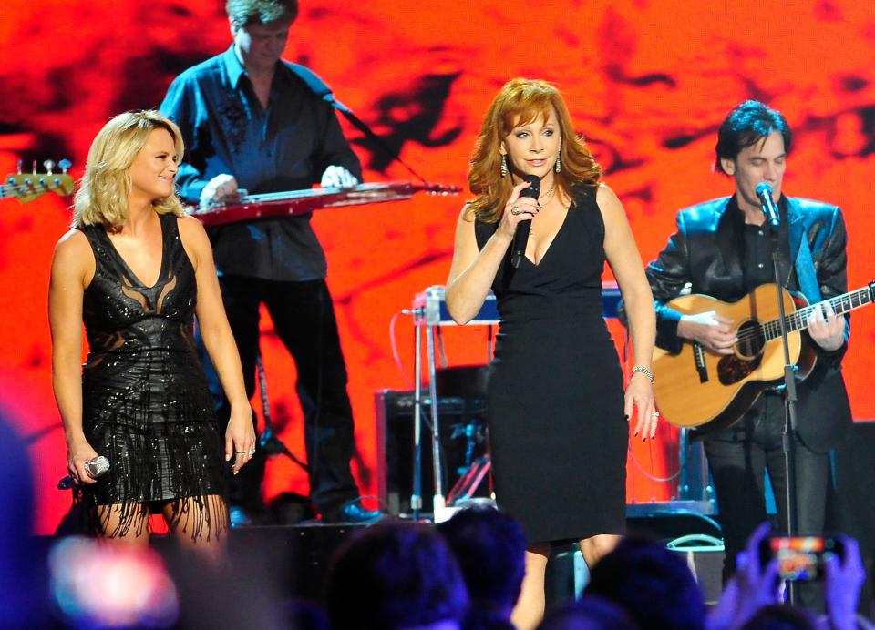 Miranda Lambert, left, and Reba McEntire perform on stage during the American Country Countdown Awards show at Music City Center in Nashville, Tenn., Monday, Dec. 15, 2014.