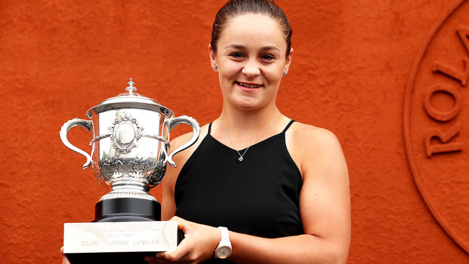 Ashleigh Barty, pictured here posing for a photo with the French Open trophy.