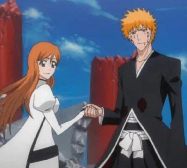 Orihime and Ichigo holding hands as they look into the distance