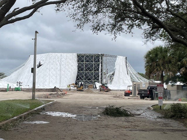 A white air-supported dome slated to be part of the SoFi Center in Palm Beach Gardens, home to a new golf venture by Tiger Woods, partially deflated Tuesday, Nov. 14, 2023 because of a power outage. The dome, seen here on Thursday, Nov. 16, was then deflated and will remain down while work is performed to repair it. The league, called TGL, is on the Gardens campus of Palm Beach State College. The dome can be seen off RCA Boulevard.