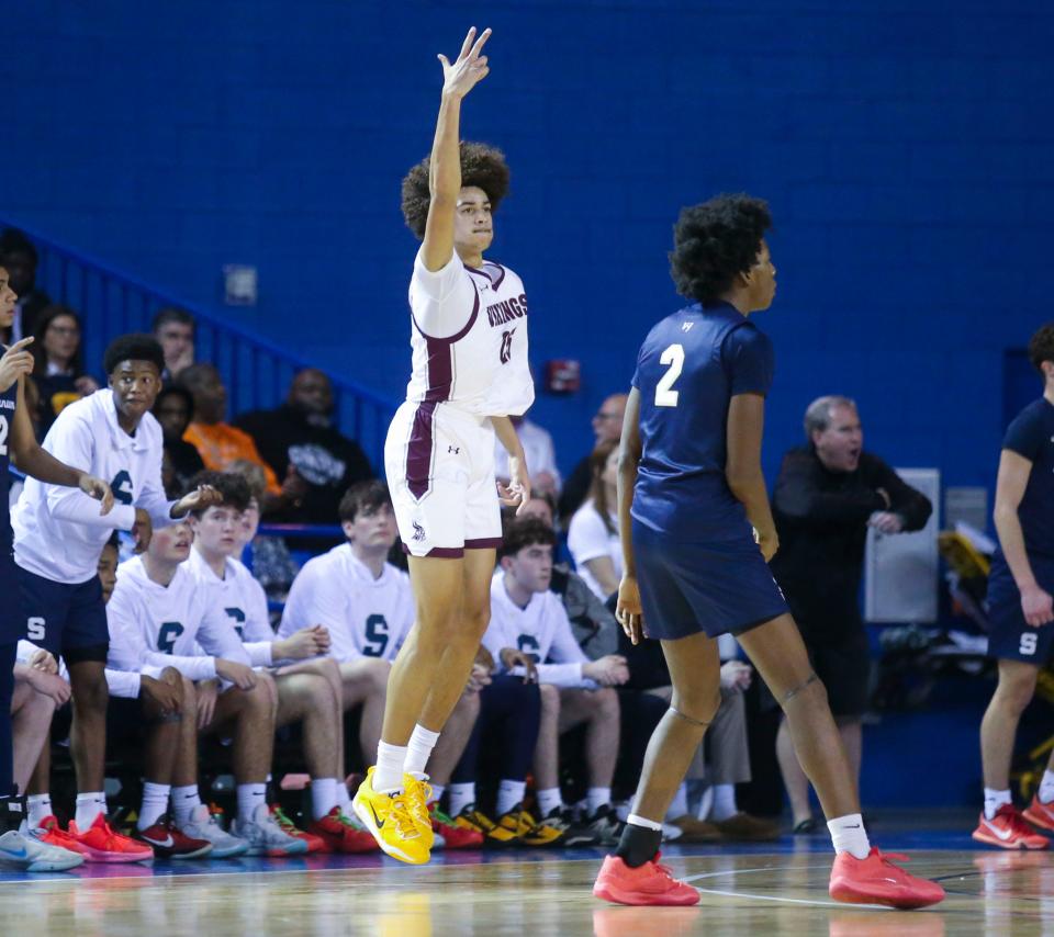 St. Elizabeth's Aiden Tobiason celebrates his 3-pointer that gave the Vikings a two-point halftime lead against Salesianum in their DIAA state tournament semifinal at the Bob Carpenter Center, Thursday, March 7, 2024.