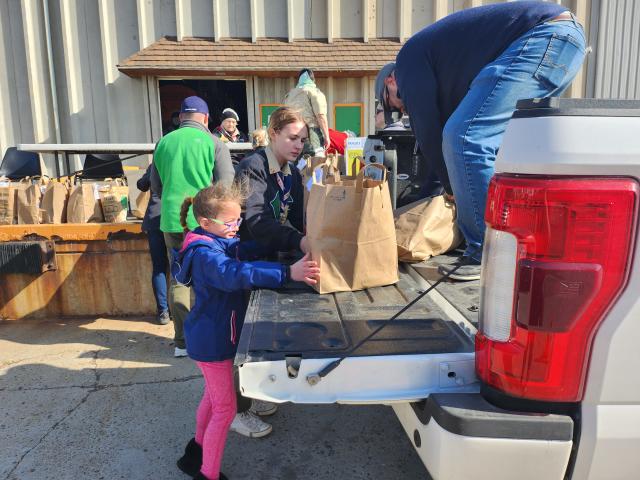 More than 50 area Boy Scout troops work to deliver food donations to the High Plains Food Bank Distribution Center Saturday morning, as they work to reach their goal of 100,000 meals raised during the 2023 Scouting for Food event.