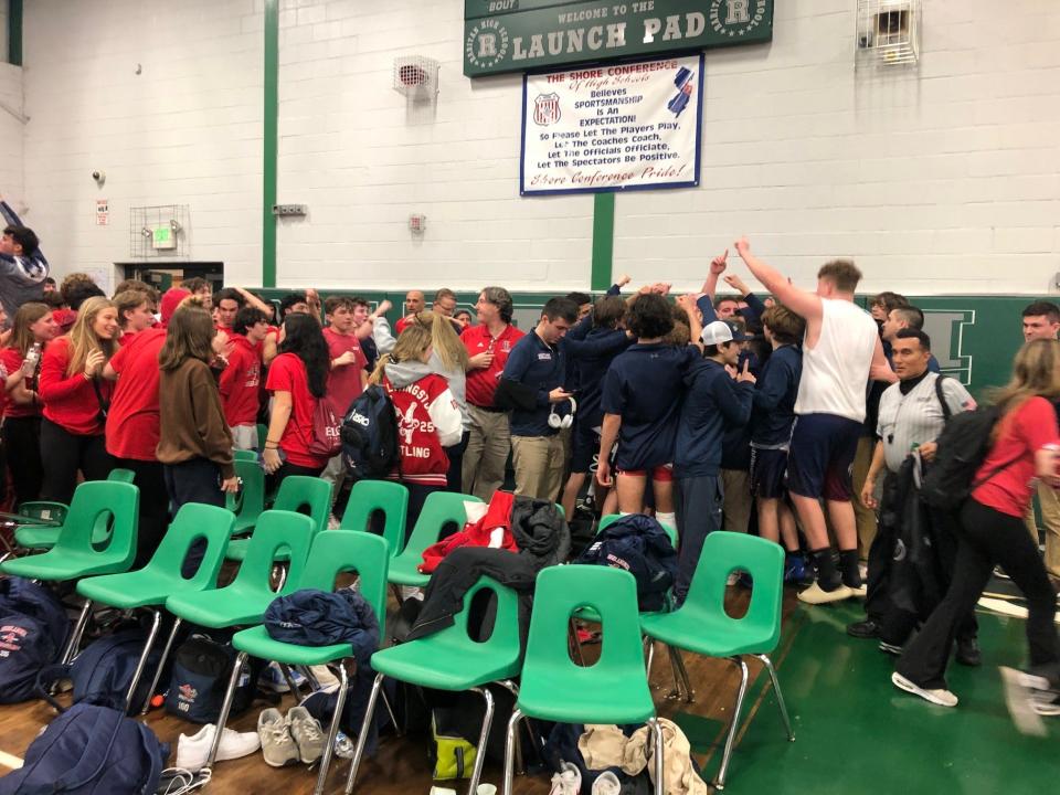 Goveenor Livingston's wrestlers and fans celebrate after Governor Livingston's 37-30 win over Raritan Friday night in a Group 2 semifinal.