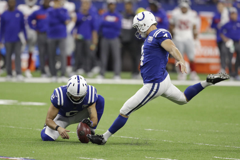 FILE - In this Dec. 23, 2018, file photo, Indianapolis Colts' Adam Vinatieri (4) kicks a field goal from the hold of Rigoberto Sanchez during the second half of the team's NFL football game against the New York Giants in Indianapolis. The 48-year-old former Colts and New England Patriots star told former teammate and SiriusXM radio host Pat McAfee that he plans to retire. “By Friday, if paperwork goes in, you heard it here first,” Vinatieri said. (AP Photo/Darron Cummings, File)