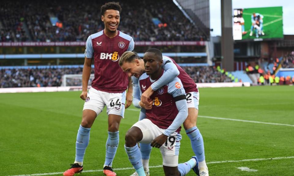 Moussa Diaby accepts the congratulations of Boubacar Kamara, left, and Matty Cash after scoring Aston Villa’s second goal