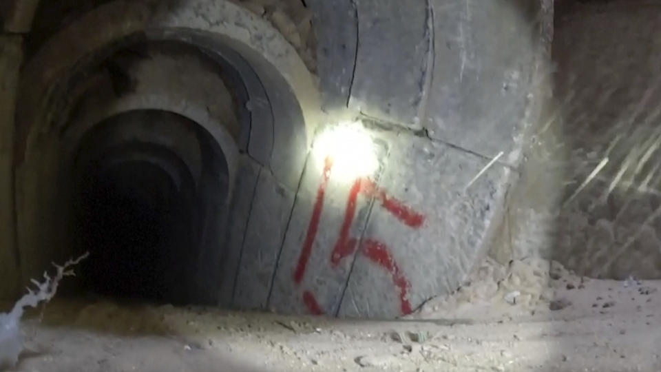 This image made from video released by the Israeli military shows bodycam footage from inside a tunnel. Israeli Defense Forces released footage on Wednesday, Nov. 8, 2023 of what they say are combat engineers locating, exposing and detonating Hamas's tunnel shafts in the Gaza Strip. (Israel Defense Forces via AP)