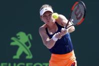 Mar 29, 2017; Miami, FL, USA; Simona Halep of Romania hits a backhand against Johanna Konta of Great Britain (not pictured) on day nine of the 2017 Miami Open at Crandon Park Tennis Center. Geoff Burke-USA TODAY Sports