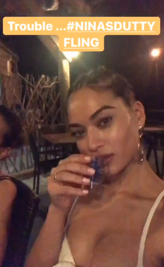 The Aussie beauty was seen throwing down an alcoholic shot. Source: shaninashaik/Instagram