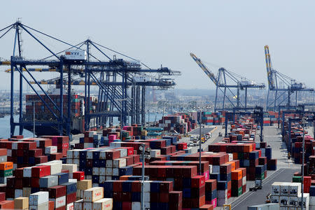 FILE PHOTO: Ship and containers are shown at the port of Los Angeles in Los Angeles, California, U.S. July 16, 2018. REUTERS/Mike Blake/File Photo