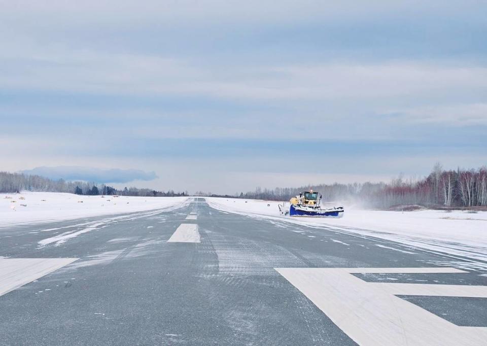 Snow is plowed off the runway at Bellingham International Airport on Thursday.