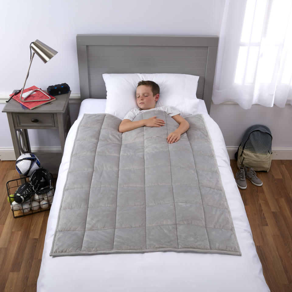 Restless sleeper? A kid-size weighted blanket might be the answer. (Photo: Walmart)