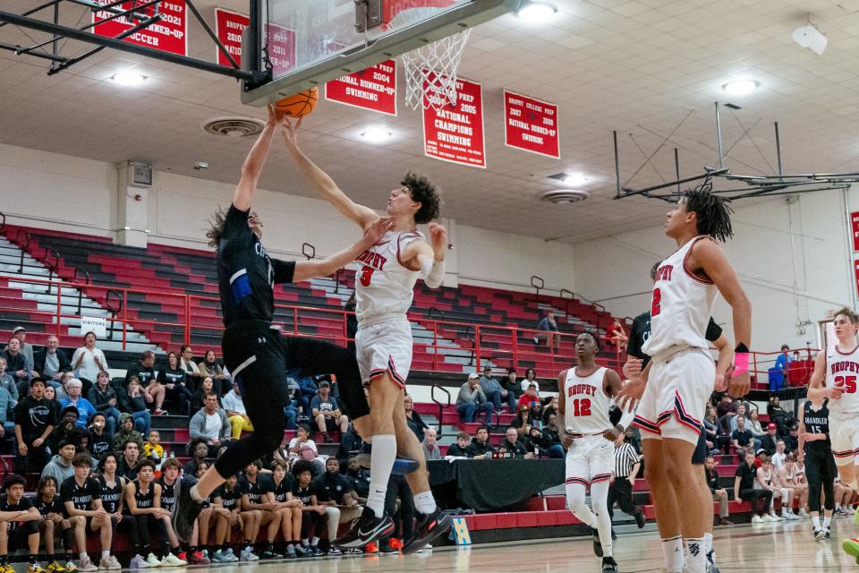 Brophy Broncos' Arman Madi (3) blocks  Chandler Wolves' Ezias Steffen (11) at Brophy College Preparatory on Feb. 16, 2023, in Phoenix.