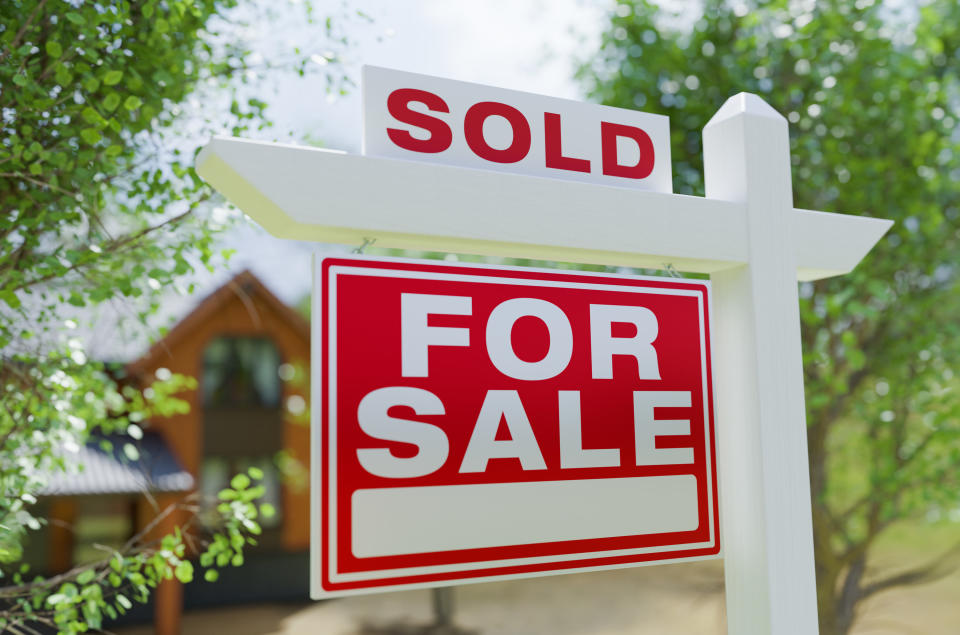 sold sign in front of a house