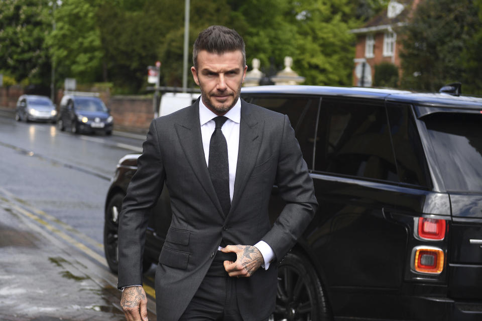 Football star David Beckham arrives at Bromley Magistrates Court for a hearing after he was spotted using his mobile phone while driving his Bentley, in London, Thursday, May 9, 2019. The magistrate has the power to impose six penalty points and a £200 fine for the charge of using a mobile while driving. (Victoria Jones/PA via AP)