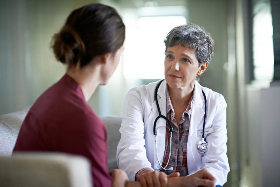 Female doctor with female patient