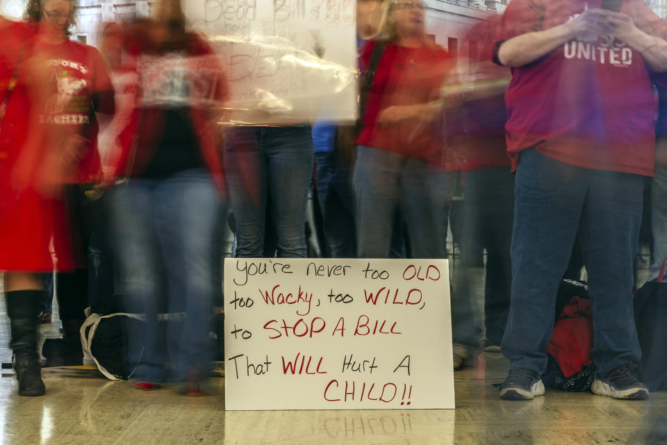 CORRECTS DAY OF WEEK TO WEDNESDAY - Teachers and school personnel, on the second day of a statewide strike, demonstrate outside the House of Delegates chamber, Wednesday, Feb. 20, 2019, at the West Virginia State Capitol in Charleston, W.Va. West Virginia public school teachers are striking for a second day even though legislation they loathed was tabled in the House of Delegates. Schools in 54 of the state's 55 counties were closed Wednesday. The lone holdout again was Putnam County. (Craig Hudson/Charleston Gazette-Mail via AP)