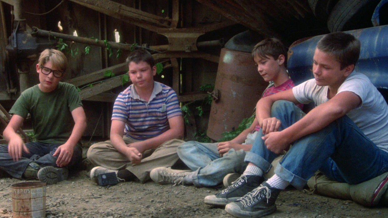  River Phoenix as Chris Chambers, Wil Wheaton as Gordie Lachance, Jerry O'Connell as Vern Tessio, and Corey Feldman as Teddy Duchamp in Stand By Me. 
