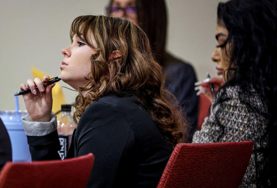 Hannah Gutierrez-Reed listens while expert witness Bryan Carpenter testifies during her involuntary manslaughter trial. / Credit: Gabriela Campos/The New Mexican / Getty Images