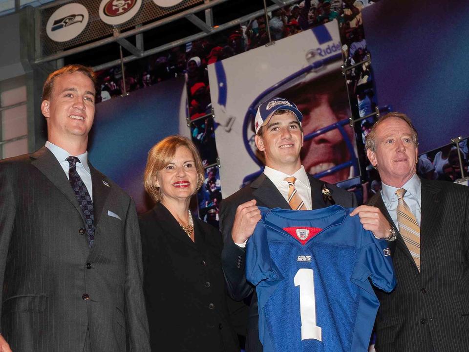 <p>Tomasso DeRosa/AP</p> Peyton Manning, mother Olivia, and father Archie Manning after Eli was traded to the New York Giants during the NFL Draft on Saturday April 24, 2004.