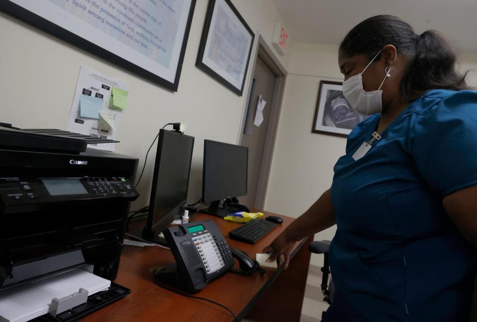 Stephanie Taylor works as the outreach manager at the Covenant House in Detroit and listens to a 23-year-old who has called in asking for help on Tuesday, May 3, 2022. Covenant House has helped over 80,000 teenagers and young adults during the past 25 years.