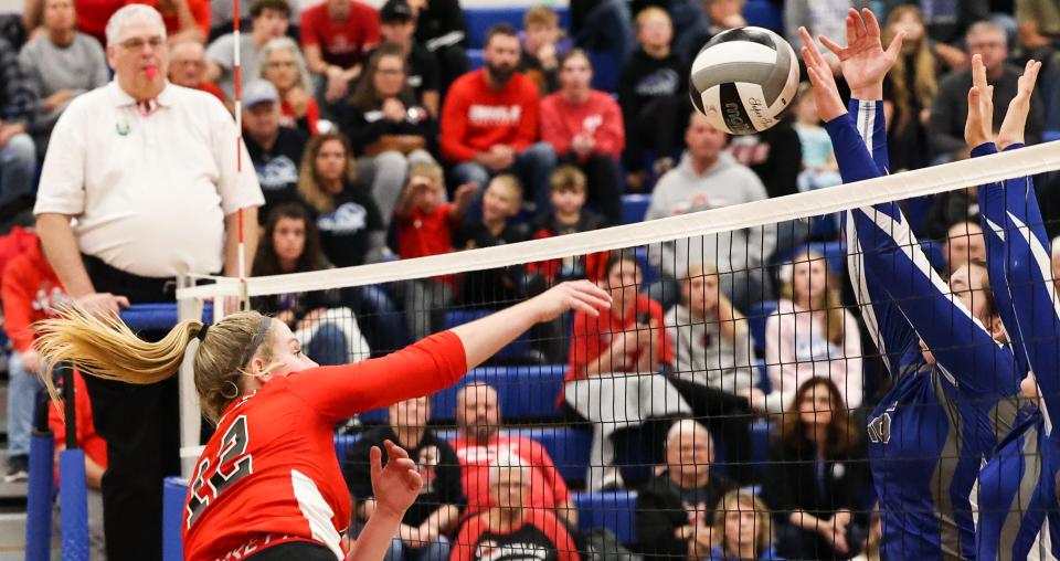 Orrville's Averi Haley smashes this kill attempt into a wall pitched by Northwestern's Lillian Wakefield and a teammate that gave the Huskies a 14-13 lead in the fifth set.