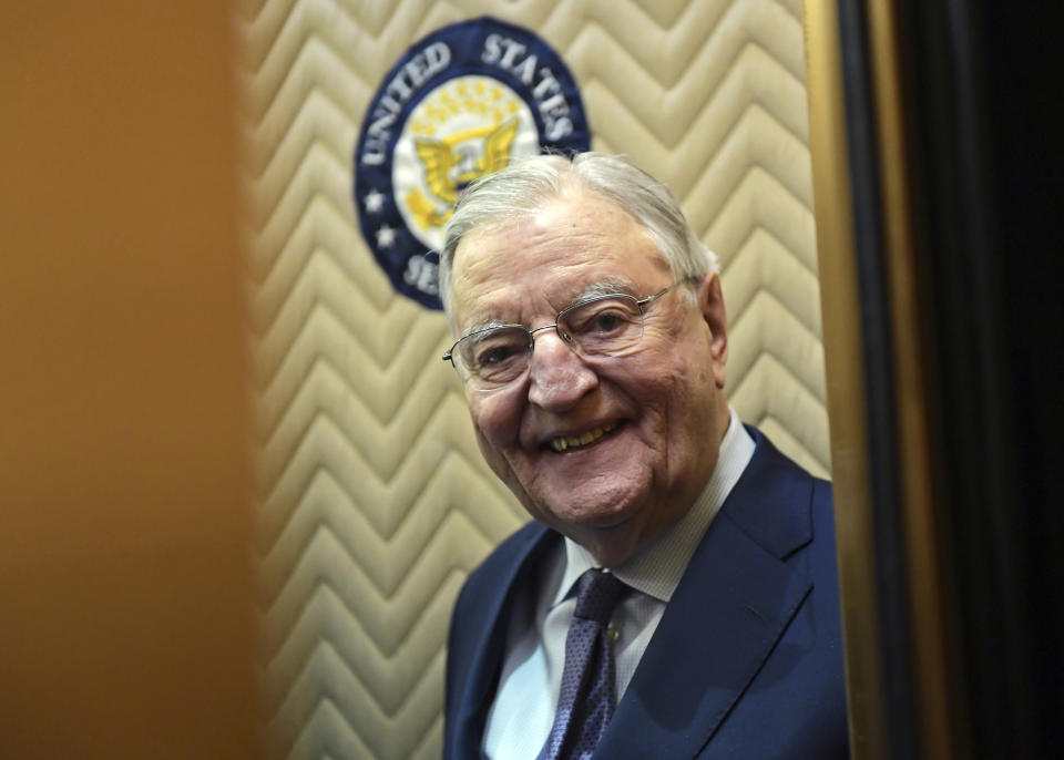 FILE - In this Wednesday, Jan. 3, 2018, file photo, former Vice President Walter Mondale smiles as he gets on an elevator on Capitol Hill in Washington. Mondale, a liberal icon who lost the most lopsided presidential election after bluntly telling voters to expect a tax increase if he won, died Monday, April 19, 2021. He was 93. (AP Photo/Susan Walsh, File)