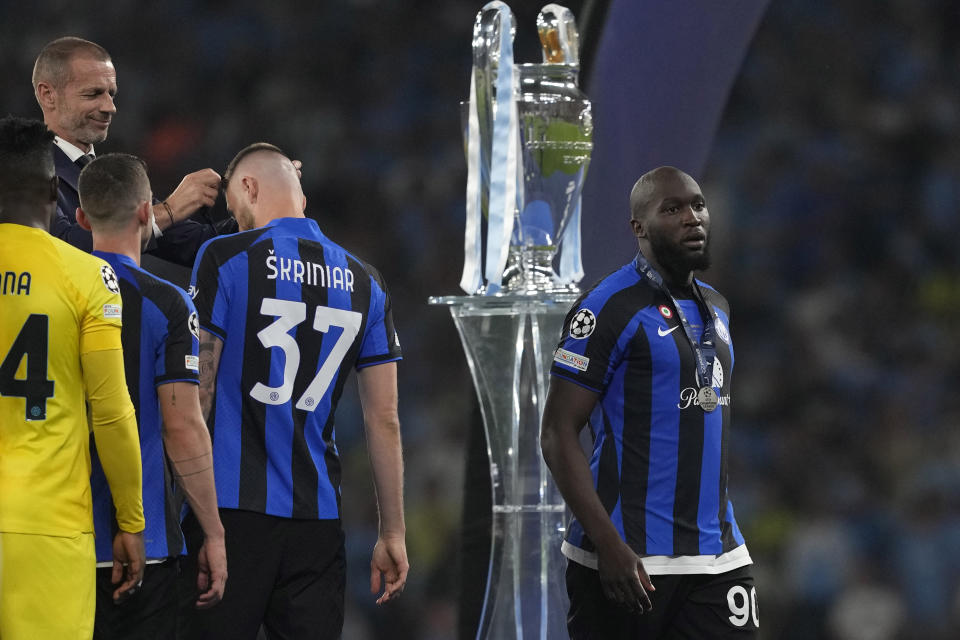 Inter Milan's Romelu Lukaku, right, gestures after he received his Silver medal at the end of the Champions League final soccer match between Manchester City and Inter Milan at the Ataturk Olympic Stadium in Istanbul, Turkey, Sunday, June 11, 2023. Manchester City defeated Inter Milan 1-0. (AP Photo/Antonio Calanni)