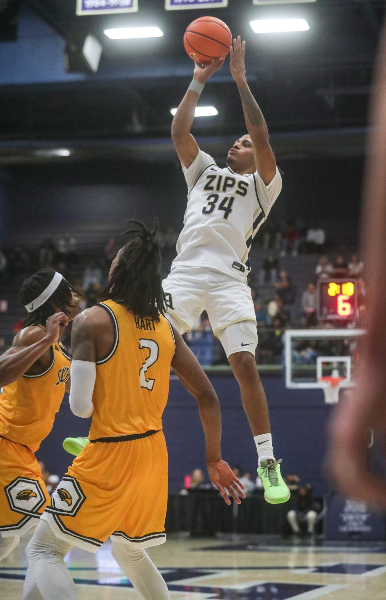 University of Akron's Nate Johnson puts up a shot in front of two Southern Miss defenders on Friday, Nov. 10, 2023.