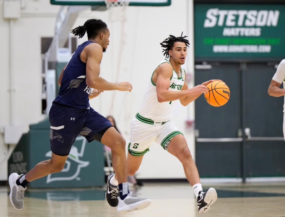 Stetson's Tristan Gross drives down the court during a game with North Florida at Stetson Edmunds Center in DeLand, Jan. 4, 2024.