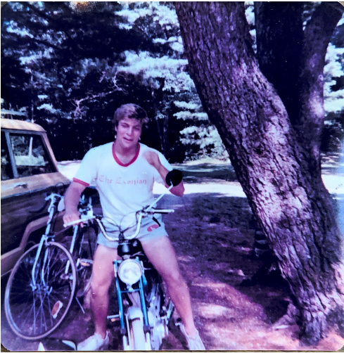 Jay Lanni, now 60, is seen as a teenager, wearing a T-shirt for the school newspaper at Phillips Exeter Academy.