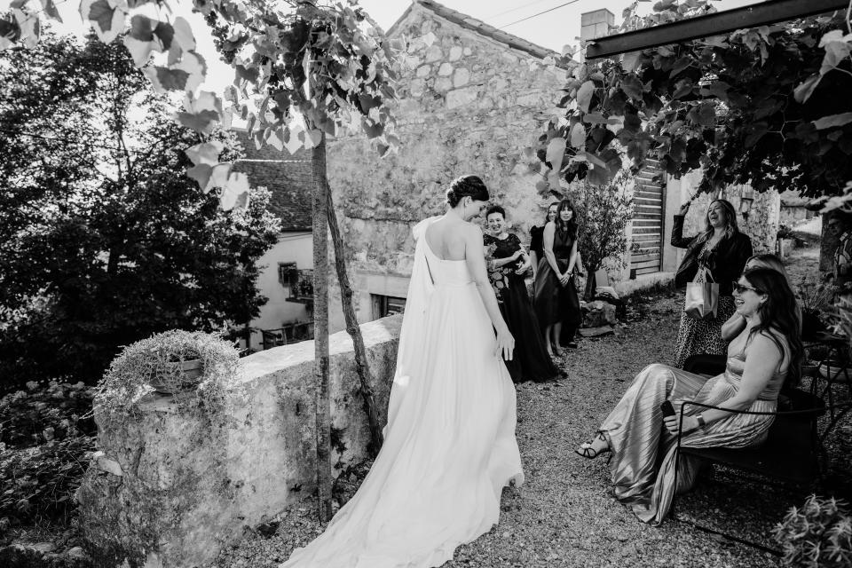 Stephanie's airy one-shoulder gown stood out against the bridal party's dark green and black gowns.