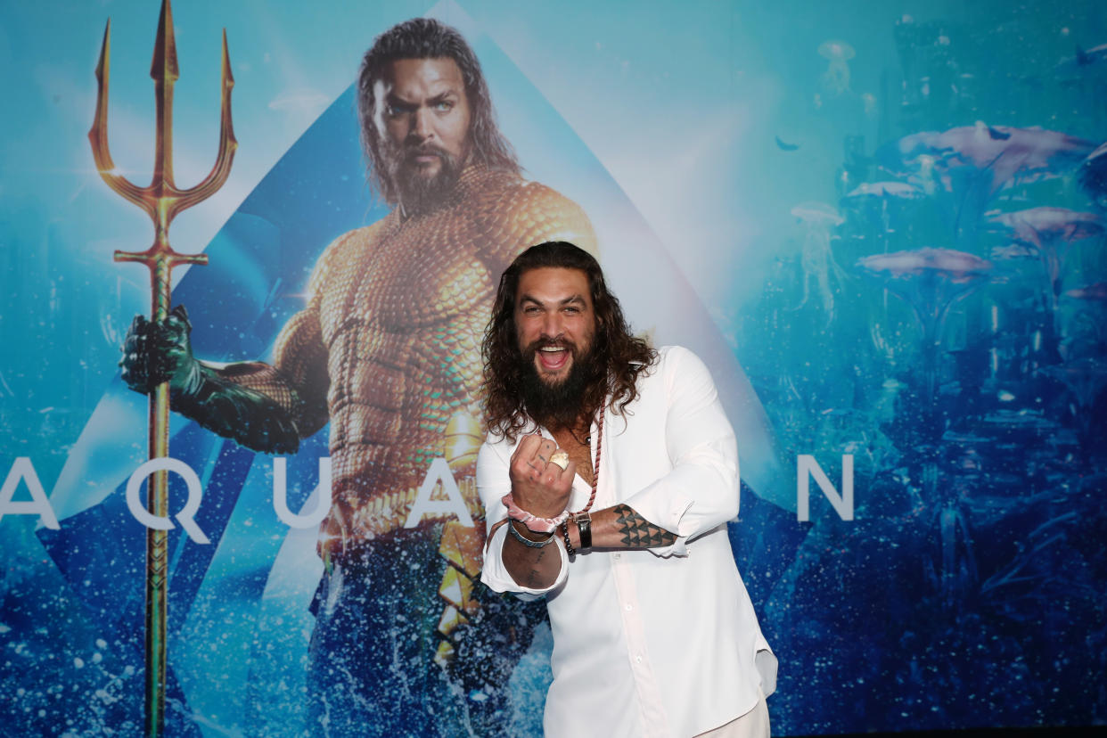 Jason Momoa (promoting the first Aquaman film in 2018) showed off his costume for the sequel. (Photo: Chris Hyde/Getty Images)