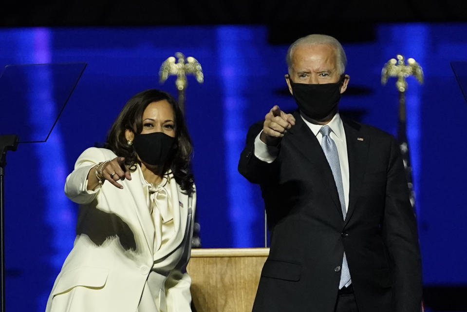 From left, Doug Emhoff, husband of Vice President-elect Kamala Harris, Harris, President-elect Joe Biden and his wife Jill Biden on stage together, Saturday, Nov. 7, 2020, in Wilmington, Del. (AP Photo/Andrew Harnik, Pool)