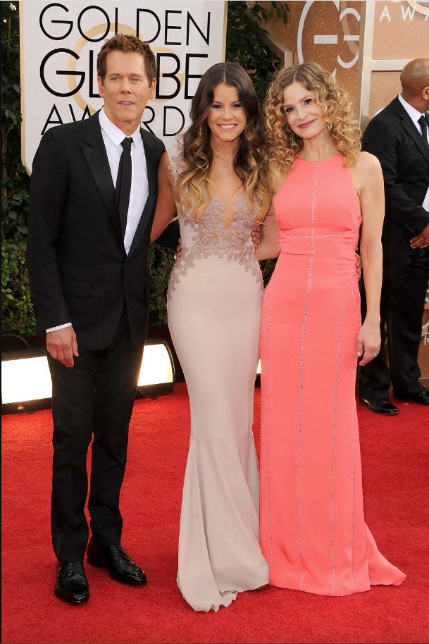 Kevin Bacon Sosie Bacon and Kyra Sedgwick standing on Golden Globes red carpet