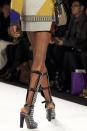 FILE - This Feb. 8, 2013 file photo shows a model wearing high boots during the Rebecca Minkoff Fall 2013 fashion show during Fashion Week in New York. As New York Fashion Week's fall previews wrapped up Thursday, designers didn't ignore the feet. (AP Photo/Karly Domb Sadof, file)